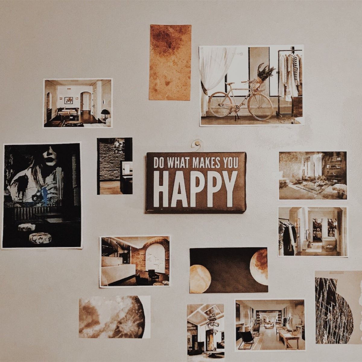 The wall features numerous postcards of various sizes, all attached with refill strips that are removable and damage-free.