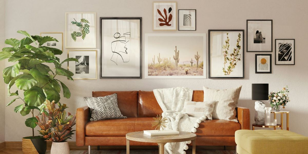 In the cozy living room, many decorative pictures of different styles are hung on the wall behind the sofa using methods to hang pictures without nails.