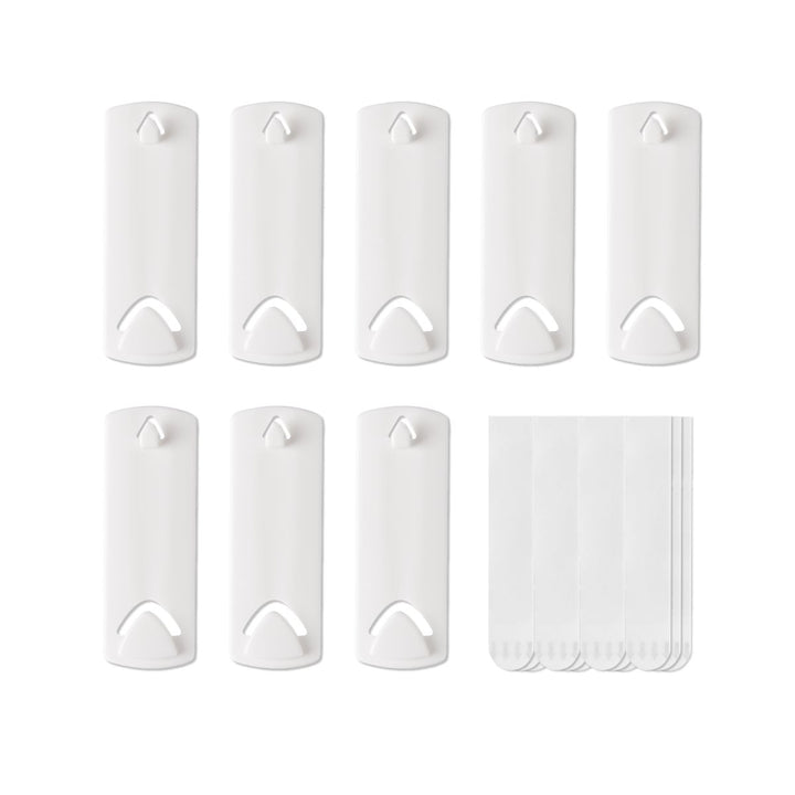 Eight picture hangers for sawtooth and wire back frames along with several strips displayed flat.