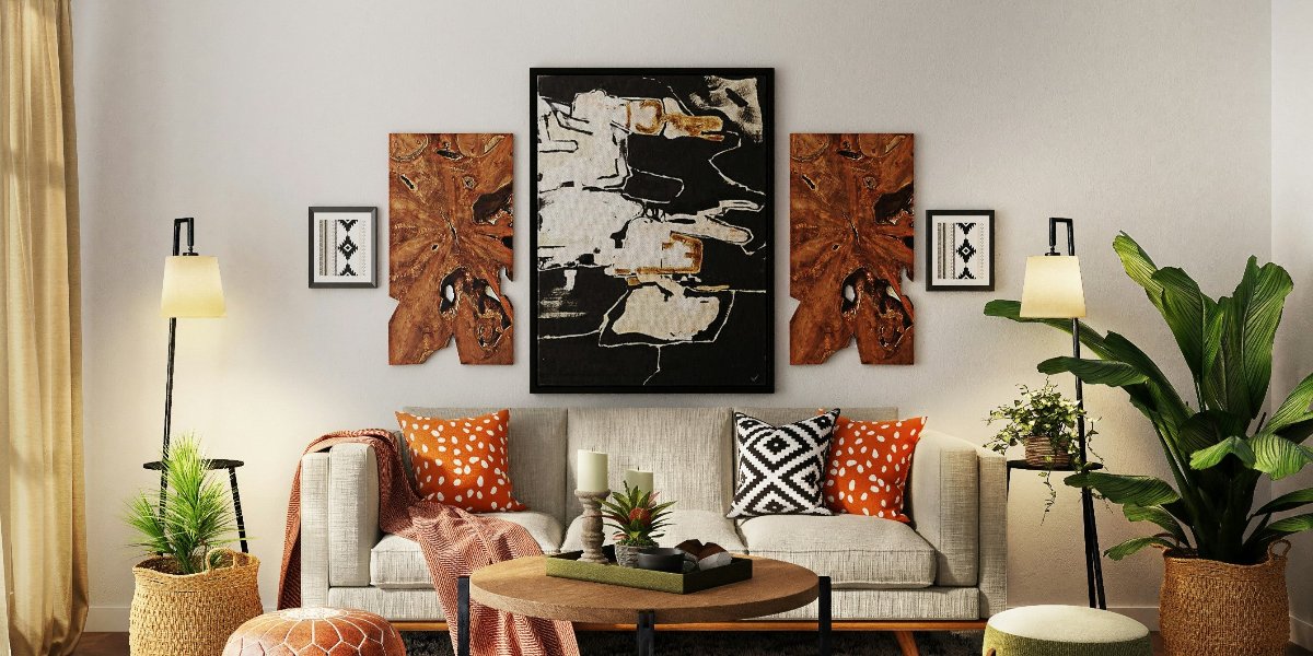 The walls of the vibrant-colored living room are adorned with several bold, colorful decorative paintings, showcasing effective picture hanging techniques.