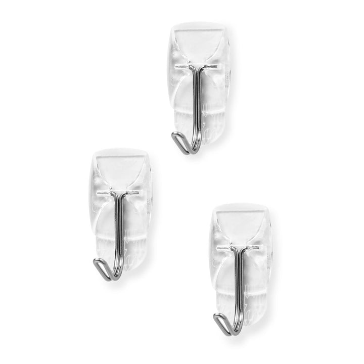 A flat display of three Clear Small Wire Toggle Hooks with strips.