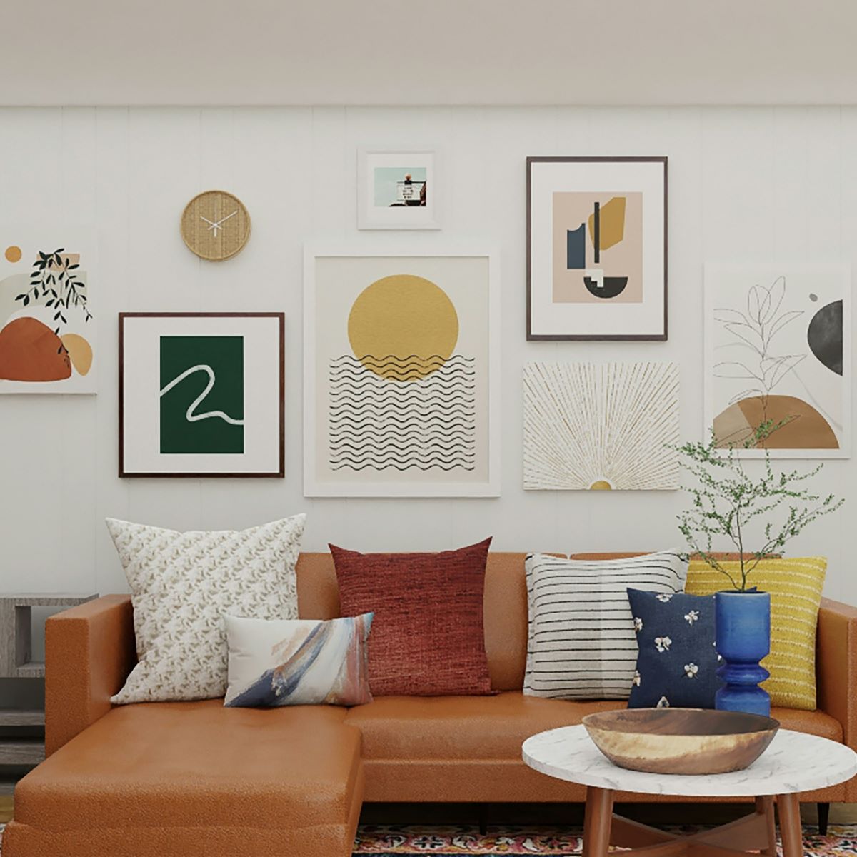 The large living room features an orange L-shaped sofa and a round marble-patterned coffee table. Behind the sofa, the wall is adorned with picture frames of various sizes and a round clock, all hung using picture hanging strips.