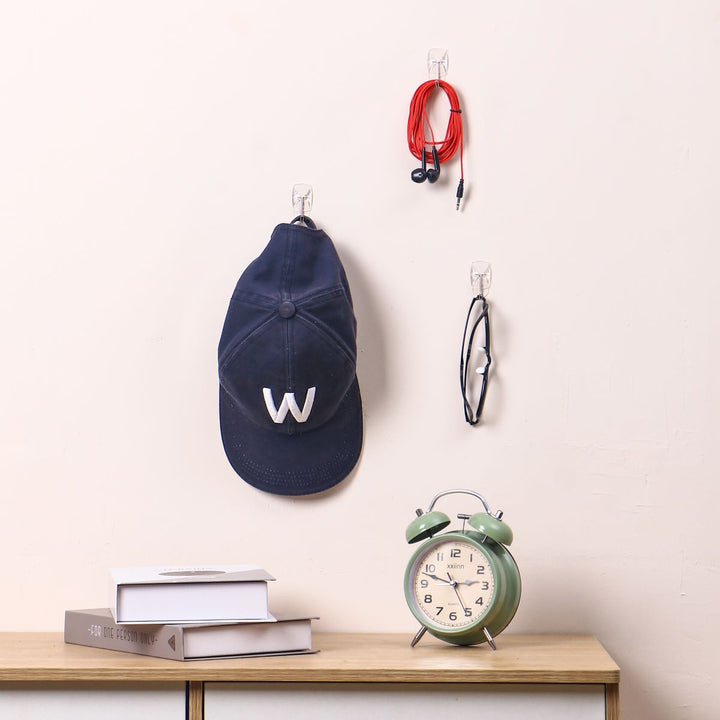 A few clear wire toggle hooks on the top of the table for hanging hats, keys, and other small items look organized.