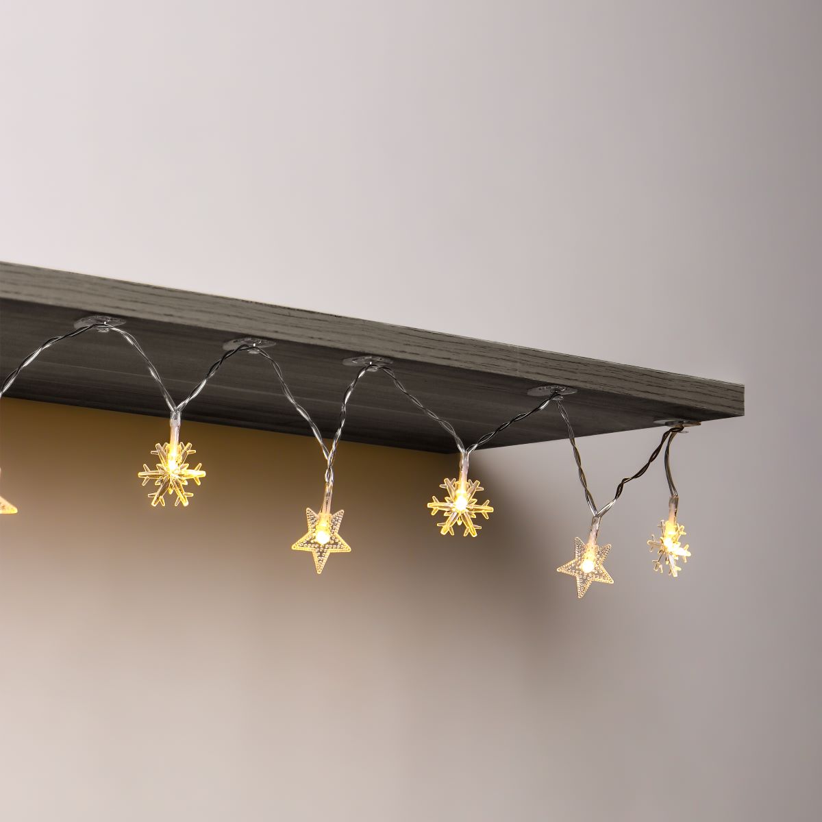 Mini clear clips to hang Christmas lights, no tools needed, and won't affect aesthetics.