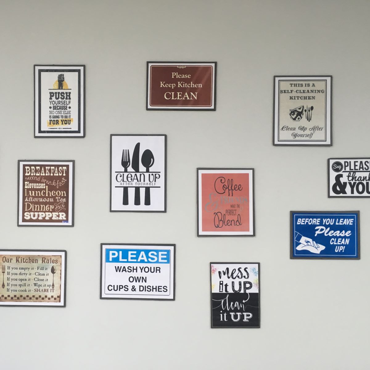 The wall is adorned with numerous postcards attached using refill strips, which are easily removable.